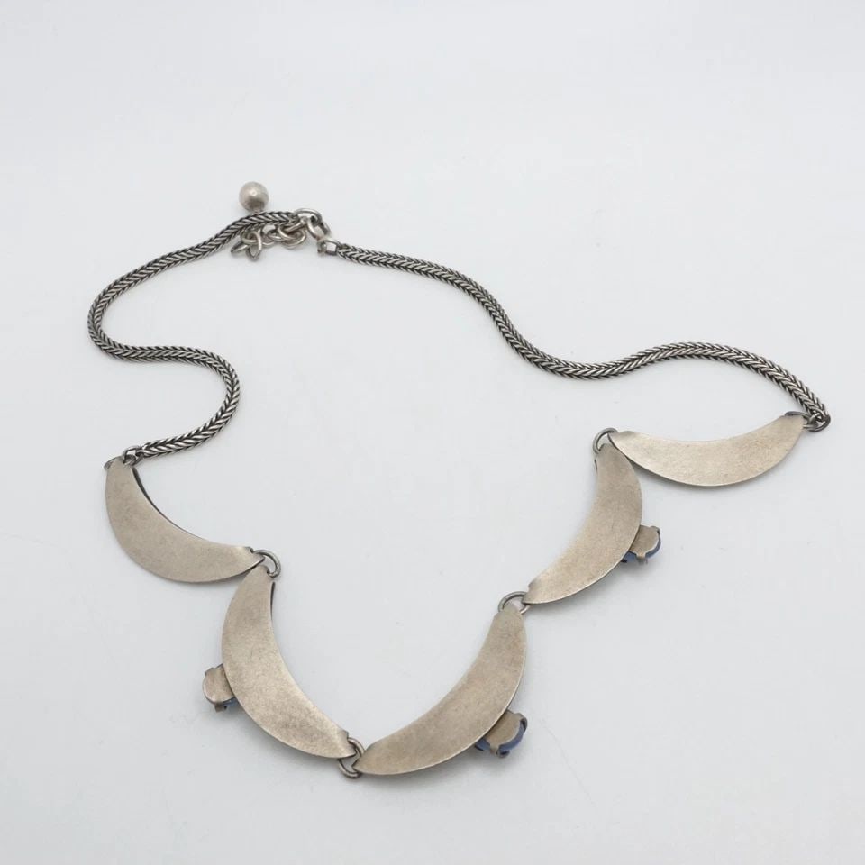 SILVER 800 CABOCHON BLUE GEMSTONE CRESCENT PANEL CHAIN NECKLACE 16.7": SILVER 800 CABOCHON BLUE GEMSTONE CRESCENT PANEL CHAIN NECKLACE 16.7" Silver 800 Blue Gemstone Crescent Panel Chain Necklace Length -16.7" Chain Width - 2mm Stone Size - 5.5 x 8mm Weight - 16.7 Grams