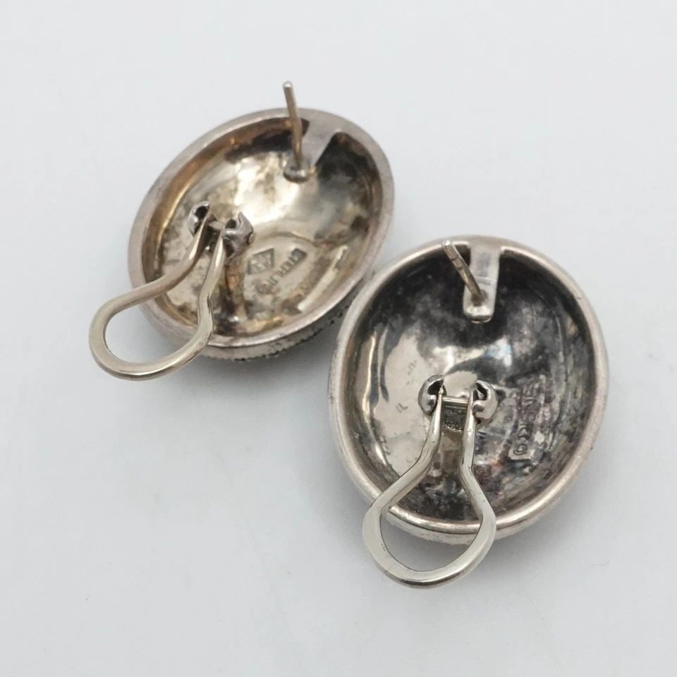 DISNEY JJ SIGNED STERLING SILVER MARCASITE OVAL OMEGA BACK DROP EARRINGS: DISNEY JJ SIGNED STERLING SILVER MARCASITE OVAL OMEGA BACK DROP EARRINGS Disney JJ Signed Sterling Silver Marcasite Oval Omega Back Drop Earrings Length - 1.1" Width - 0.80" Total Weight - 19.7 Grams 
