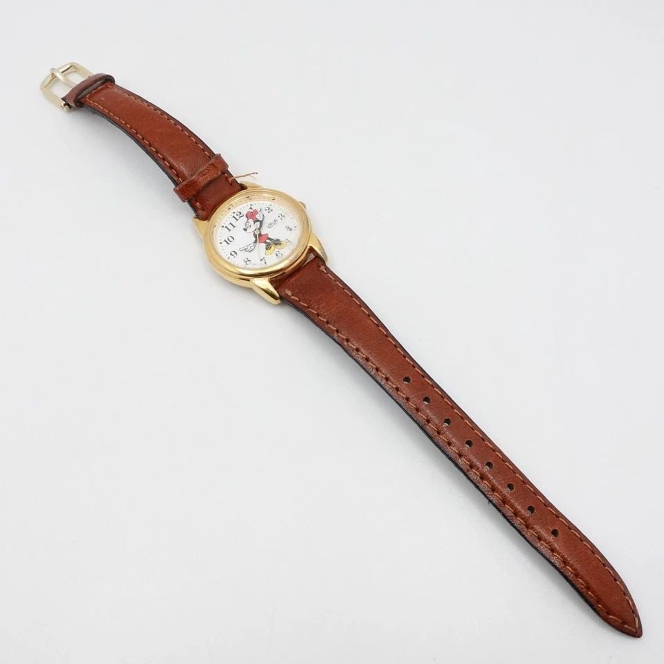LORUS DISNEY YELLOW GOLD PLATED MINNIE MOUSE QUARTZ WATCH - 26MM PARTS REPAIR: Vintage Lorus Disney Minnie Mouse Yellow Gold Plated Quartz Watch Case Size - 26mm Total Length - 7.8" Band Width - 11mm approx. Lug Width - 13mm **Watch is NOT running** **Sold As Is for Parts or Rep