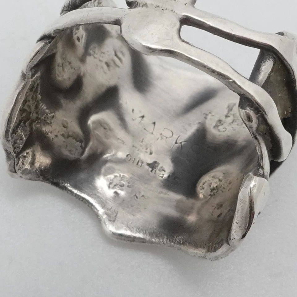STERLING SILVER ABSTRACT HAMMERED WIDE BAND RING SIZE 9: STERLING SILVER ABSTRACT HAMMERED WIDE BAND RING SIZE 9 Sterling Silver Abstract Hammered Wide Band Ring Size - 9 Band Width - 6.5mm Height - 19.5mm Total Weight - 6.3 Grams Hallmark - MARKSZ STERLING