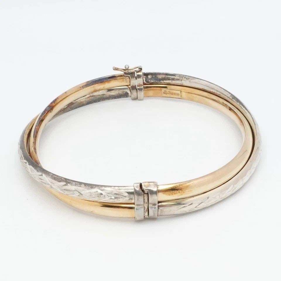 STERLING SILVER 14K GOLD FILLED TWO TONE TWIST HINGED BANGLE BRACELET 7.75": STERLING SILVER 14K GOLD FILLED TWO TONE TWIST HINGED BANGLE BRACELET 7.75" Sterling Silver 1/20 14K Yellow Gold Filled Two Tone Twist Hinged Bangle Bracelet Fits up 7.75" Wrist Width - 9mm & 5mm Tota