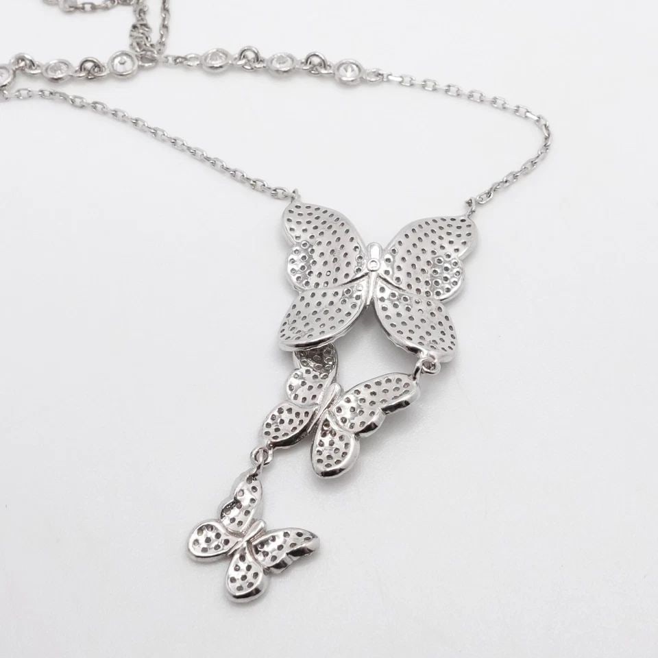 ITALY STERLING SILVER PAVE BUTTERFLY CLEAR CZ CUBIC ZIRCONIA DANGLE NECKLACE: ITALY STERLING SILVER PAVE BUTTERFLY CLEAR CZ CUBIC ZIRCONIA DANGLE NECKLACE Italy Sterling Silver Pave Butterfly Clear Cubic Zirconia Dangle Charm Necklace Length - 18 - 20" Chain Width - 1mm & 4mm P
