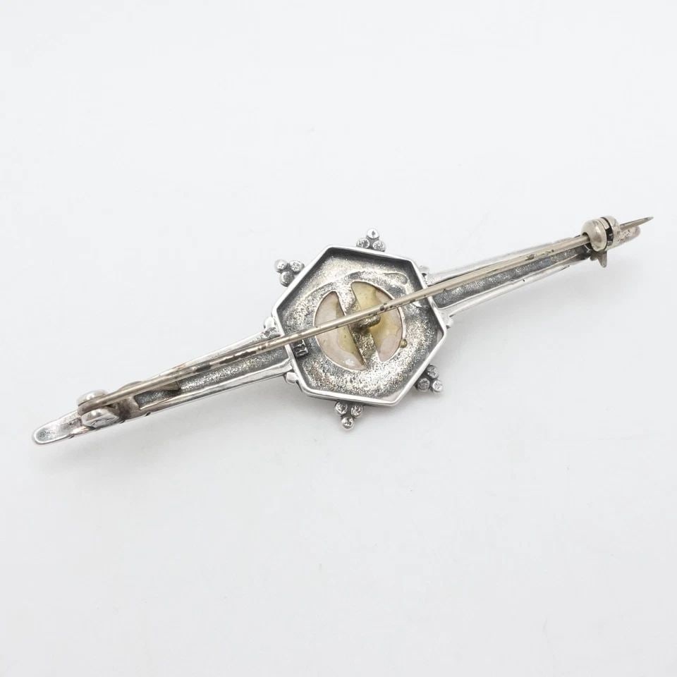STERLING SILVER MOTHER OF PEARL ART DECO BROOCH PIN 2.75": STERLING SILVER MOTHER OF PEARL ART DECO BROOCH PIN 2.75" Sterling Silver Mother of Pearl Brooch Pin Length - 2.75" Width - 0.5" Total Weight - 8.4 Grams