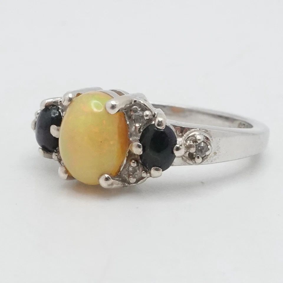 STERLING SILVER OVAL OPAL THREE STONE RING SIZE 7.25: STERLING SILVER OVAL OPAL THREE STONE RING SIZE 7.25 Sterling Silver Oval Opal Three Stone Ring Size - 7.25 Band Width - 2mm Main Stone Height - 8mm Total Weight - 3.1Grams