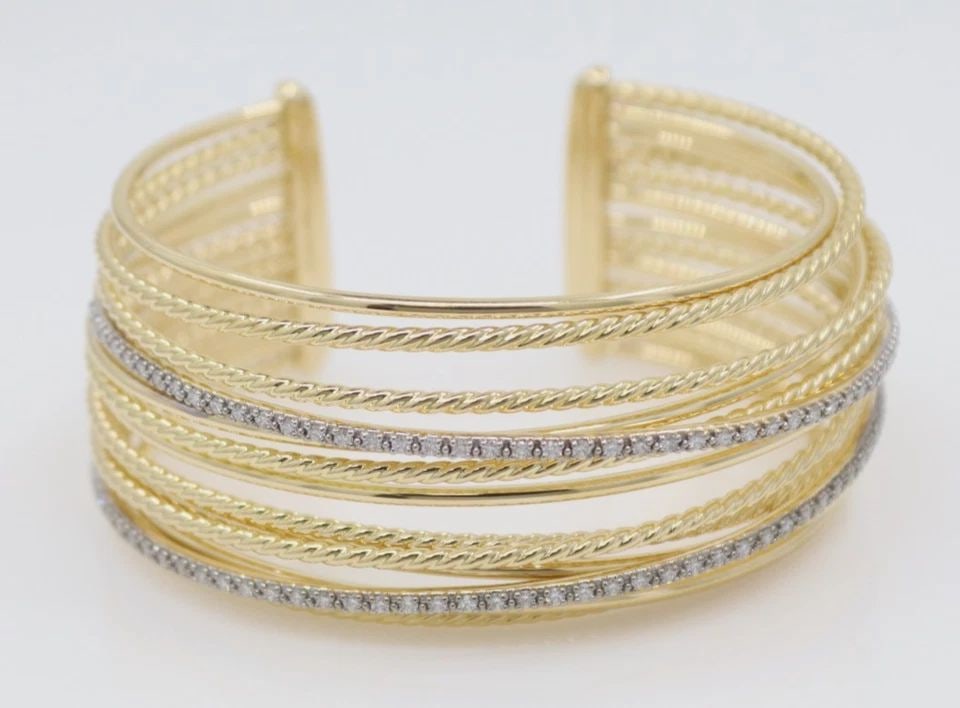 DAVID YURMAN 18K YELLOW GOLD DIAMOND CROSSOVER CUFF BRACELET 6.25" - 55.1 GRAMS: DAVID YURMAN 18K YELLOW GOLD DIAMOND CROSSOVER CUFF BRACELET 6.25" - 55.1 GRAMS Description David Yurman 18K Yellow Gold Diamond Crossover Cuff Bracelet Inspired by the artistic collaboration between 