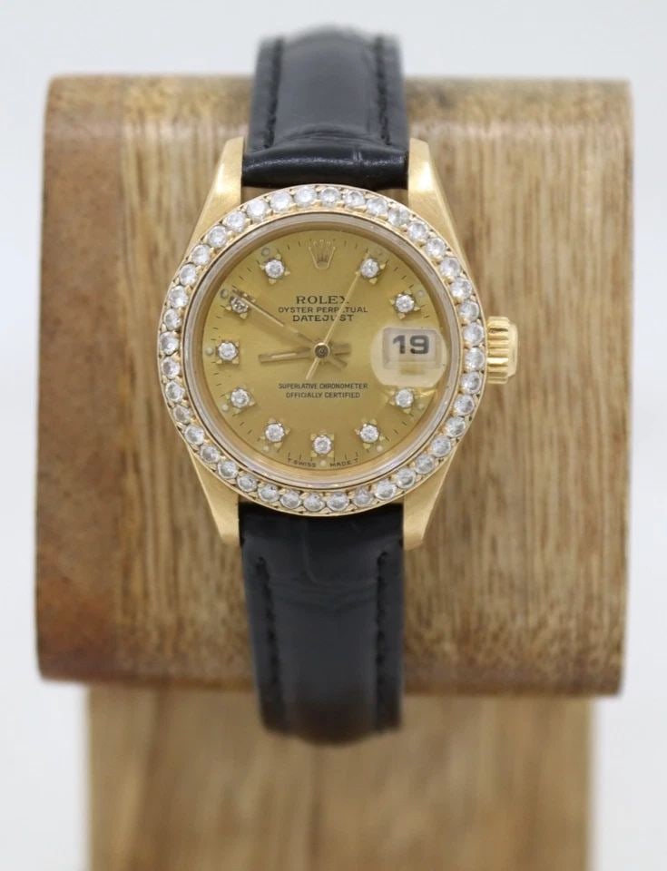 ROLEX PRESIDENT DATEJUST 18K GOLD 26MM CHAMPAGNE DIAL DIAMOND BEZEL WATCH 69178: ROLEX PRESIDENT DATEJUST 18K GOLD 26MM CHAMPAGNE DIAL DIAMOND BEZEL WATCH 69178 Description Rolex President Datejust 18k Yellow Gold 26mm Champagne Diamond Dial & Diamond Bezel Watch 69178 The watch h