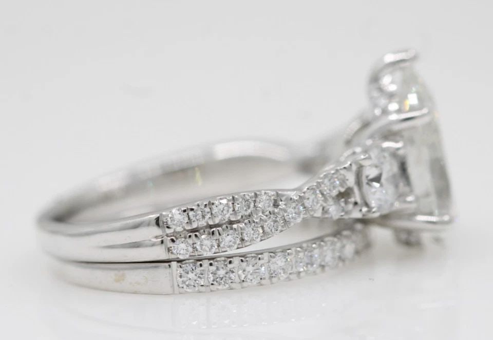 14K WHITE GOLD 2.82 TCW LAB GROWN PEAR-SHAPED DIAMOND ENGAGEMENT RING SET: 14K WHITE GOLD 2.82 TCW LAB GROWN PEAR-SHAPED DIAMOND ENGAGEMENT RING SET Description 14K White Gold 2.82 TCW Lab Grown Pear-Shaped Diamond Engagement Ring Set Rings are in good condition. May show si