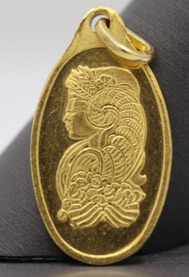 PAMP SUISSE .9999 5 GRAM FINE GOLD LADY FORTUNA OVAL BAR PENDANT: PAMP SUISSE .9999 5 GRAM FINE GOLD LADY FORTUNA OVAL BAR PENDANT Description Pamp Suisse .9999 5 Gram Fine Gold Lady Fortuna Oval Bar Pendant Bar/pendant is in circulated condition. Shows signs of wea