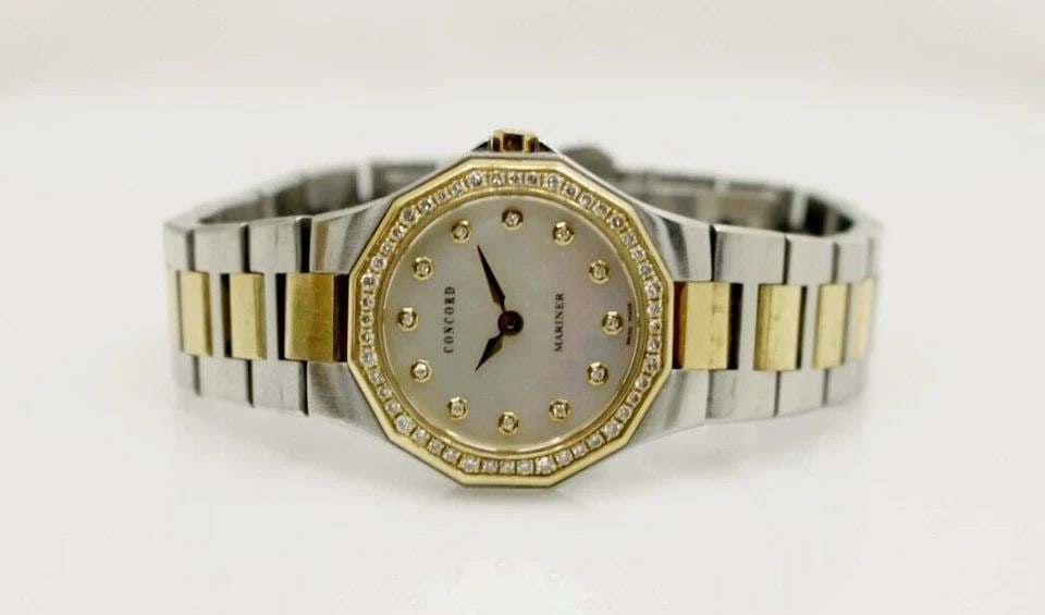 CONCORD MARINER 18K GOLD & STAINLESS 26 MM MOP DIAL DIAMOND BEZEL WATCH 0311396: CONCORD MARINER 18K GOLD & STAINLESS 26 MM MOP DIAL DIAMOND BEZEL WATCH 0311396 CONCORD MARINER 18K GOLD & STAINLESS 26 MM MOP DIAL DIAMOND BEZEL WATCH 0311396 Description Concord Mariner Two Tone 18K