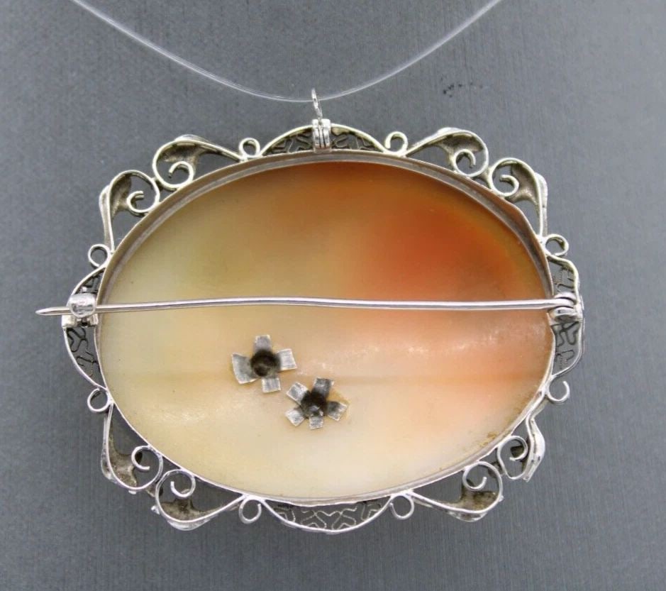 14K WHITE GOLD CARVED CAMEO DIAMOND PENDANT BROOCH 12.6 GRAMS: 14K WHITE GOLD CARVED CAMEO DIAMOND PENDANT BROOCH 12.6 GRAMS 14K WHITE GOLD CARVED CAMEO DIAMOND PENDANT BROOCH 12.6 GRAMS Description 14K White Gold Carved Cameo Diamond Pendant Brooch The pendant /