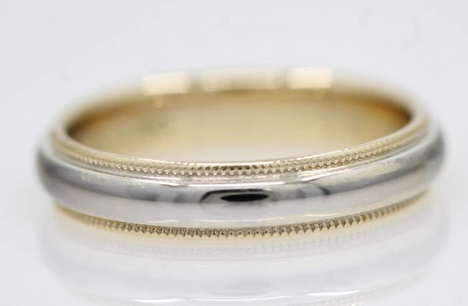 TIFFANY & CO. 18K TWO TONE 4MM MILGRAIN WEDDING BAND RING SIZE 6 - 4.3 GRAMS: TIFFANY & CO. 18K TWO TONE 4MM MILGRAIN WEDDING BAND RING SIZE 6 - 4.3 GRAMS Description Tiffany & Co. 18K Two Tone 4mm Milgrain Wedding Band Ring Ring is in good condition. May show signs of wear. AP