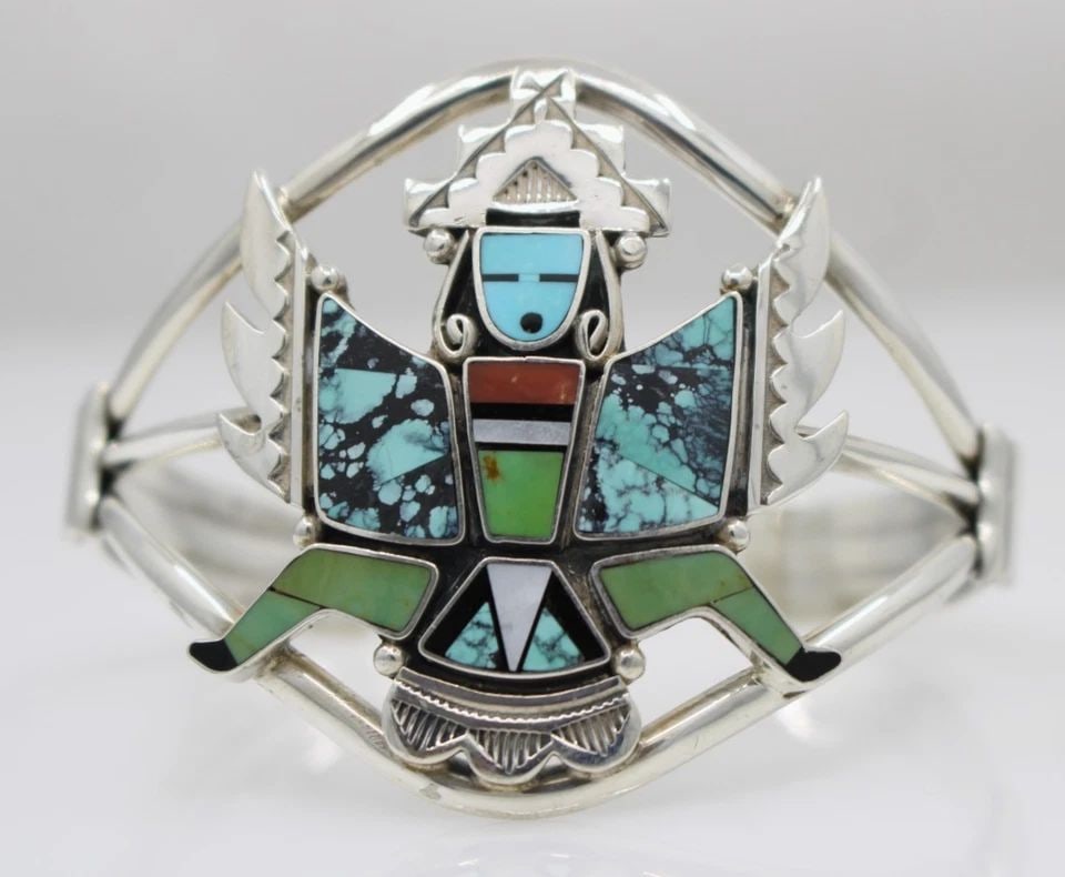 NAVAJO DANNY D. CLARK STERLING SILVER KNIFEWING DANCER TURQUOISE INLAY CUFF 6": NAVAJO DANNY D. CLARK STERLING SILVER KNIFEWING DANCER TURQUOISE INLAY CUFF 6" Description Navajo Danny D. Clark Sterling Silver Knifewing Dancer Turquoise Inlay Cuff Bracelet is in good condition. Ma