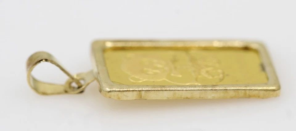 VINTAGE SINGAPORE MINT 1 GRAM .9999 GOLD PANDA GRAM BAR IN 14K GOLD BEZEL: VINTAGE SINGAPORE MINT 1 GRAM .9999 GOLD PANDA GRAM BAR IN 14K GOLD BEZEL Description Vintage Singapore Mint 1 Gram .9999 Gold Panda Gram Bar in 14k Gold Bezel Bar/pendant are in average circulated co