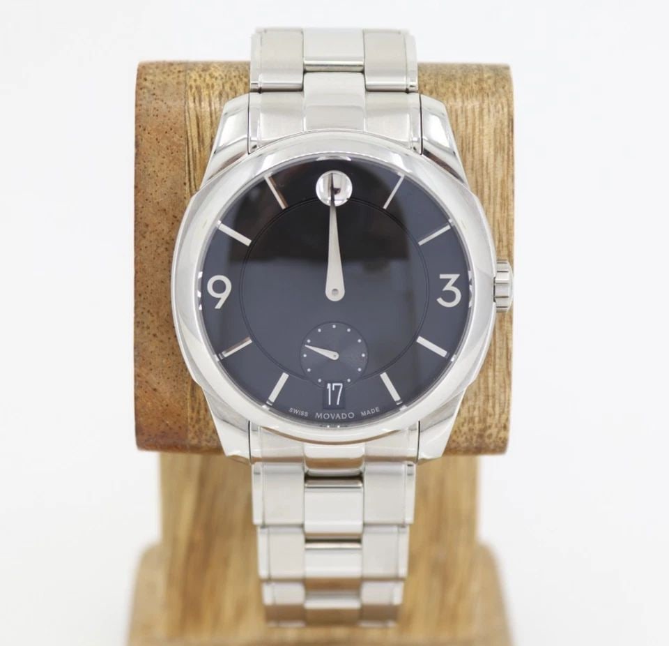 MOVADO LX STAINLESS 42MM BLACK DATE DIAL QUARTZ WATCH W/ BOX 38.1.14.1206: MOVADO LX STAINLESS 42MM BLACK DATE DIAL QUARTZ WATCH W/ BOX 38.1.14.1206 Description Movado LX Stainless 42mm Black Date Dial Quartz Watch W/ Box 38.1.14.1206 The watch has been used previously. The 