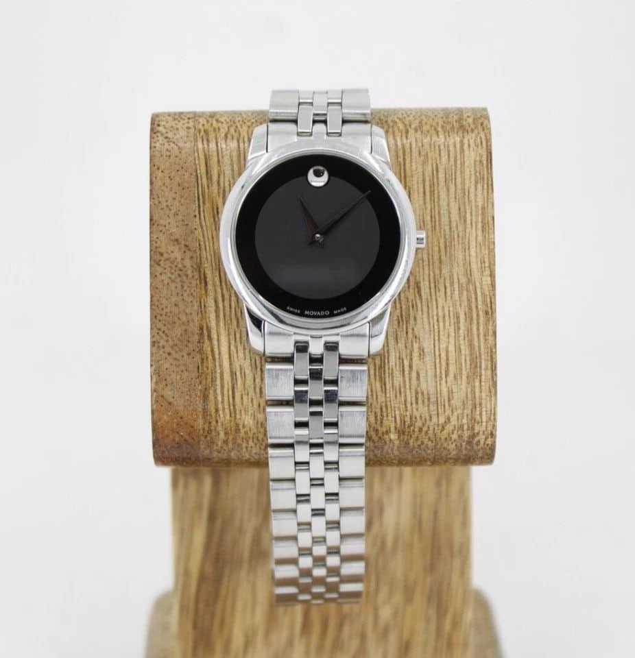 LADIES MOVADO MUSEUM CLASSIC STAINLESS STEEL WATCH BLACK DIAL 07.3.14.1143 28MM: LADIES MOVADO MUSEUM CLASSIC STAINLESS STEEL WATCH BLACK DIAL 07.3.14.1143 28MM LADIES MOVADO MUSEUM CLASSIC STAINLESS STEEL WATCH BLACK DIAL 07.3.14.1143 28MM Description Ladies Movado Museum Classic
