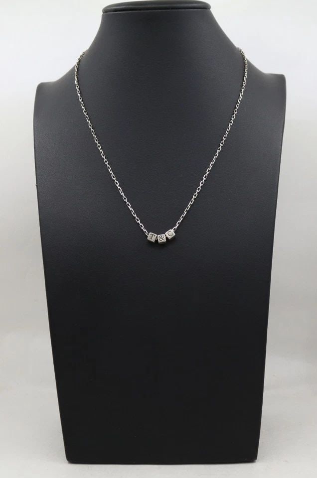 TIFFANY & CO. STERLING SILVER T & CO CUBE PENDANT CHARMS NECKLACE 18": TIFFANY & CO. STERLING SILVER T & CO CUBE PENDANT CHARMS NECKLACE 18" Description Tiffany & Co. Sterling Silver T & Co Cube Pendant Charms Necklace Necklace is in good condition. May show signs of wea