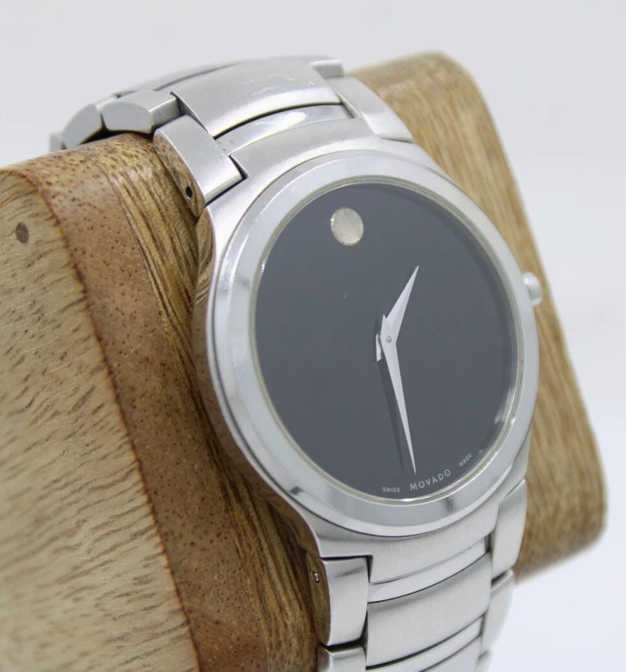 MOVADO KARDELO STAINLESS 36MM BLACK DIAL WATCH 84 G2 1851 W/ BOX & PAPERS: MOVADO KARDELO STAINLESS 36MM BLACK DIAL WATCH 84 G2 1851 W/ BOX & PAPERS Description Movado Kardelo Stainless 36mm Black Dial Watch 84 G2 1851 W/ Box & Papers The watch has been used previously. The 