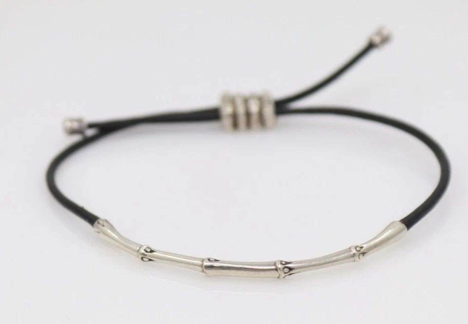 JOHN HARDY STERLING SILVER SLIM BLACK CORD ADJUSTABLE BAMBOO BRACELET: JOHN HARDY STERLING SILVER SLIM BLACK CORD ADJUSTABLE BAMBOO BRACELET Description John Hardy Sterling Silver Slim Black Cord Adjustable Bamboo Bracelet Bracelet is in good condition. May show signs of