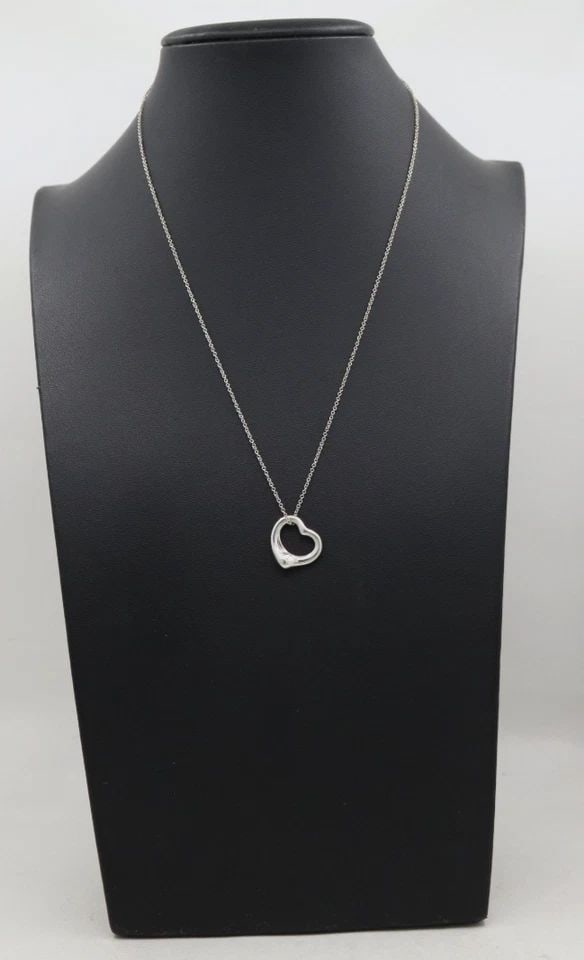 TIFFANY & CO. ELSA PERETTI STERLING SILVER 16MM OPEN HEART PENDANT 18" NECKLACE: TIFFANY & CO. ELSA PERETTI STERLING SILVER 16MM OPEN HEART PENDANT 18" NECKLACE Description Tiffany & Co. Elsa Peretti Sterling Silver 16mm Open Heart Pendant Necklace Necklace/pendant is in good cond