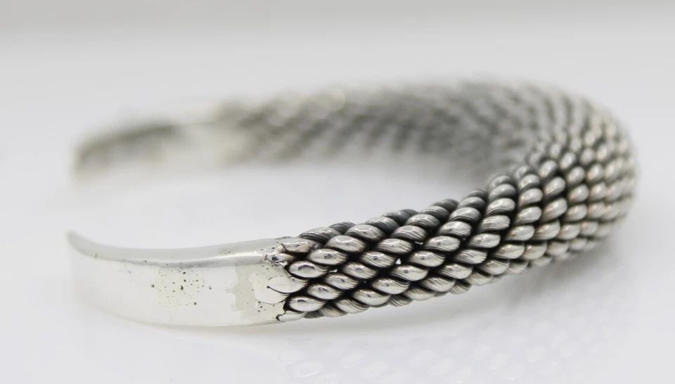 STERLING SILVER 925 CUFF BRACELET 6" - 49 GRAMS: STERLING SILVER 925 CUFF BRACELET 6" - 49 GRAMS Description Sterling Silver 925 Cuff Bracelet 6" - 49 Grams Bracelet is in good condition. May show signs of wear and/or tear. Approximate Measurements 