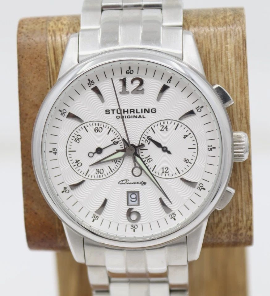 STUHRLING ORIGINAL STAINLESS STEEL 43MM WHITE DATE DIAL QUARTZ WATCH: STUHRLING ORIGINAL STAINLESS STEEL 43MM WHITE DATE DIAL QUARTZ WATCH Description Stuhrling Original Stainless Steel 43mm White Date Dial Quartz Watch The watch has been used previously. The watch may 