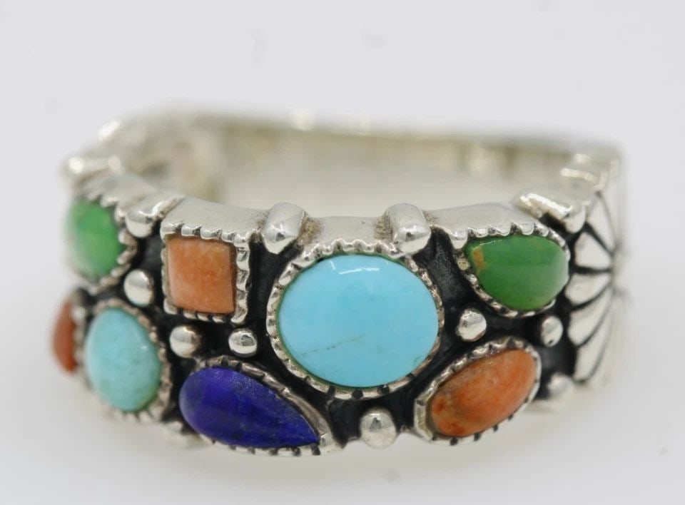 NK STERLING SILVER THAILAND MULTICOLOR GEMSTONE RING SIZE 9 - 8.4 GRAMS: NK STERLING SILVER THAILAND MULTICOLOR GEMSTONE RING SIZE 9 - 8.4 GRAMS Description NK Sterling Silver Thailand Multicolor Gemstone Ring Ring is in good condition. May show signs of wear and/or tear. 