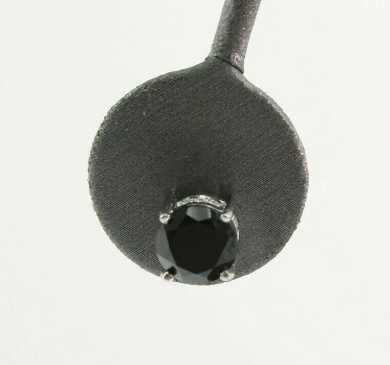 6 TCW BLACK ONYX STONES IN STERLING SILVER ACCENT EARRINGS: 6 TCW BLACK ONYX STONES IN STERLING SILVER ACCENT EARRINGS Description Black Onyx Studs in Sterling Silver w/Cubic Zirconia Earrings Item is in great condition. May show signs of wear and/or tarnish. 