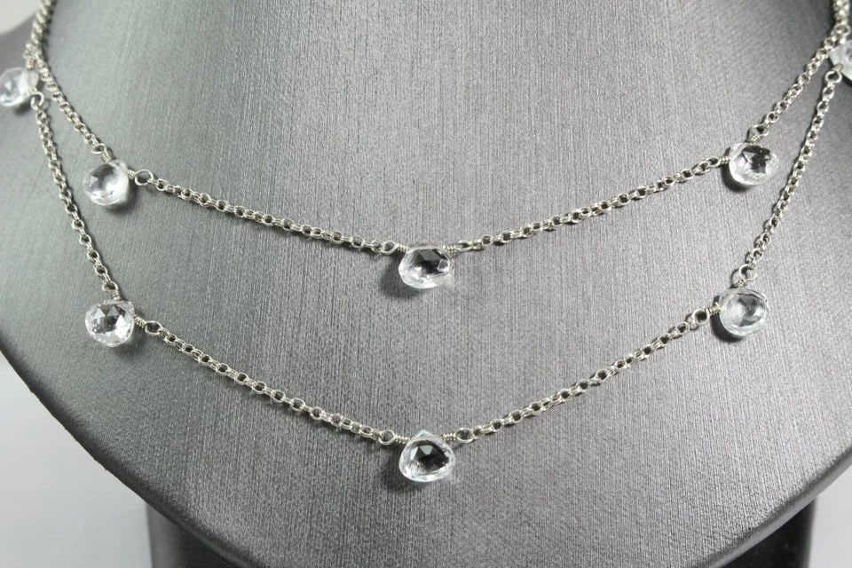 STERLING SILVER 2 STRAND NECKLACE W/ DANGLING TEARDROP SHAPE CRYSTAL -ADJUSTABLE: STERLING SILVER 2 STRAND NECKLACE W/ DANGLING TEARDROP SHAPE CRYSTAL -ADJUSTABLE Description Sterling Silver 2 Strand Necklace w/ Dangling Teardrop Shape Crystals Item is in great condition. May show 