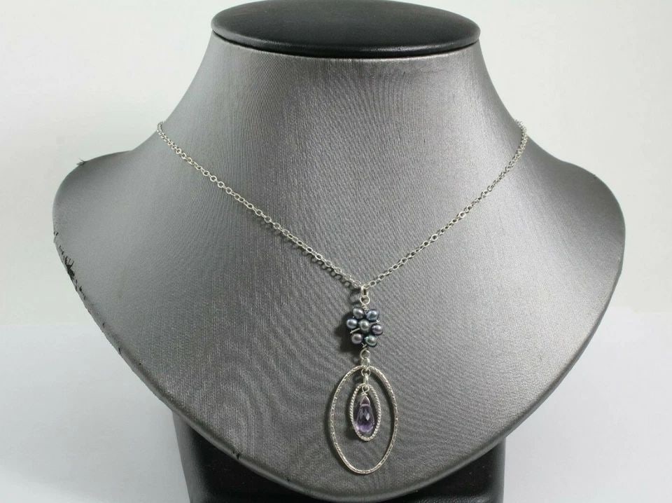 STERLING SILVER NECKLACE W/PURPLE DANGLING STONE & BLISTER PEARL FLOWER DESIGN: STERLING SILVER NECKLACE W/PURPLE DANGLING STONE & BLISTER PEARL FLOWER DESIGN Description Sterling Silver Necklace with Oval Shaped Pendant w/dangling Purple Tear Drop Shaped Stone and Blister Pearls