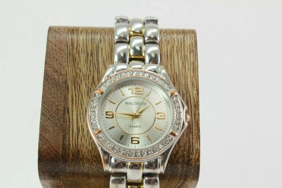 WALTHAM TWO TONE CRYSTAL BEZEL SILVER DIAL STAINLESS STEEL LADIES WATCH WTH23: WALTHAM TWO TONE CRYSTAL BEZEL SILVER DIAL STAINLESS STEEL LADIES WATCH WTH23 Description WALTHAM TWO TONE CRYSTAL BEZEL SILVER DIAL STAINLESS STEEL LADIES WATCH WTH23 New battery Installed. In great 