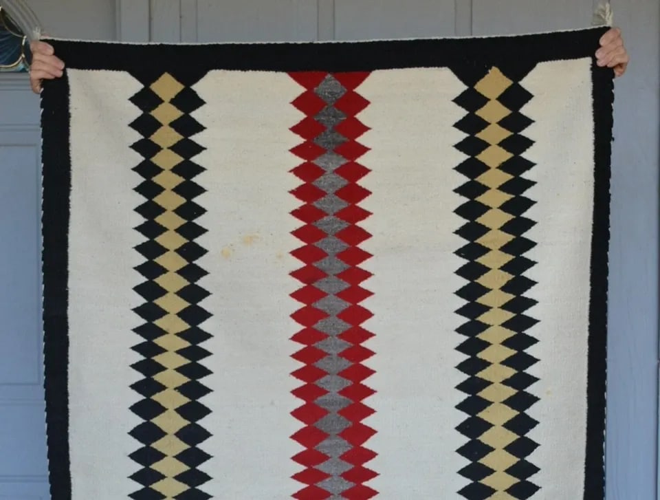 OLD NAVAJO RUG - RED BLACK TAN GREY VERTICAL BANDS ON WHITE GROUND - 62 X 42.5: OLD NAVAJO RUG - RED BLACK TAN GREY VERTICAL BANDS ON WHITE GROUND - 62 X 42.5 This Antique Navajo Rug has a great bold design. It is in very good condition. It measures 62" x 42.5". **Both sides of t