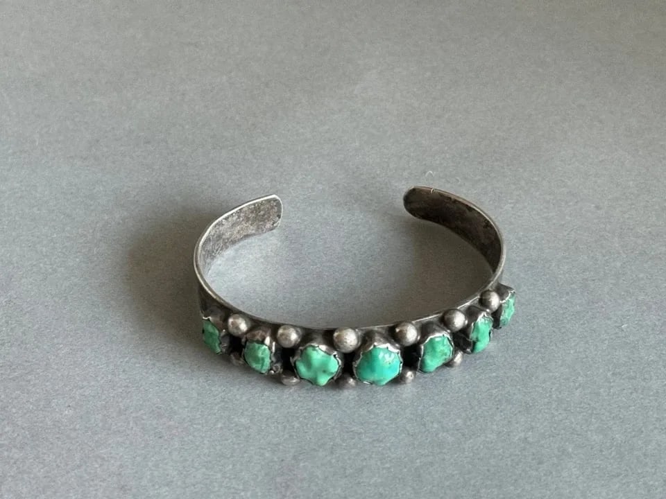 OLD PAWN NAVAJO STERLING SILVER AND CARVED TURQUOISE BRACELET.: OLD PAWN NAVAJO STERLING SILVER AND CARVED TURQUOISE BRACELET. Old Pawn Navajo Sterling Silver and carved Turquoise Bracelet.1/2 " wide .5 1/4" Inside with a 1" Opening