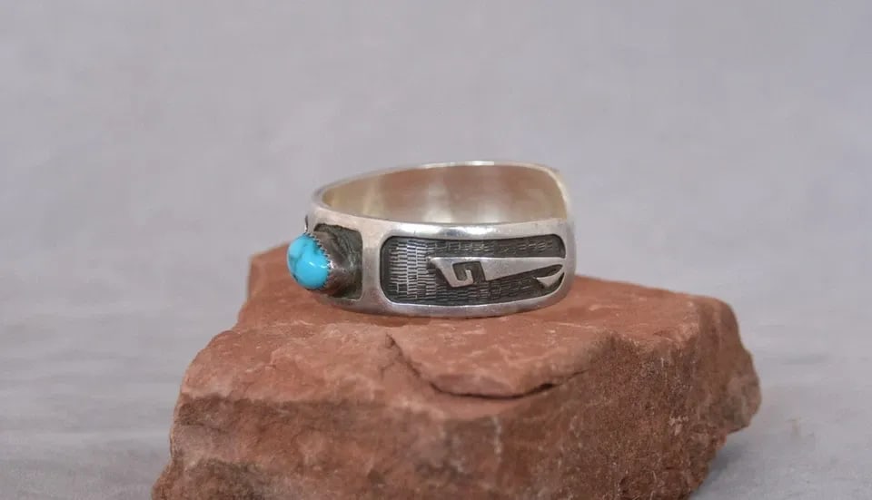 VINTAGE HOPI SILVER BRACELET - TURQUOISE - PRAYER FEATHER DESIGN - 6 3/8": VINTAGE HOPI SILVER BRACELET - TURQUOISE - PRAYER FEATHER DESIGN - 6 3/8" This vintage bracelet has been beautifully crafted with prayer feather and kiva symbols. It is made of thick sterling silver a