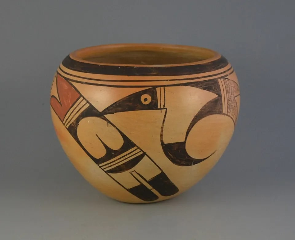 LAURA CHAPELLA TOMOSIE 1907-1981- OLD VINTAGE HOPI POT-7 1/2 " PARROT DESIGN: LAURA CHAPELLA TOMOSIE 1907-1981- OLD VINTAGE HOPI POT-7 1/2 " PARROT DESIGN This old Hopi pot was made by Hopi Tewa potter Laura Chapella Tomosie (1907-1981). It shows a wonderful parrot wing design.