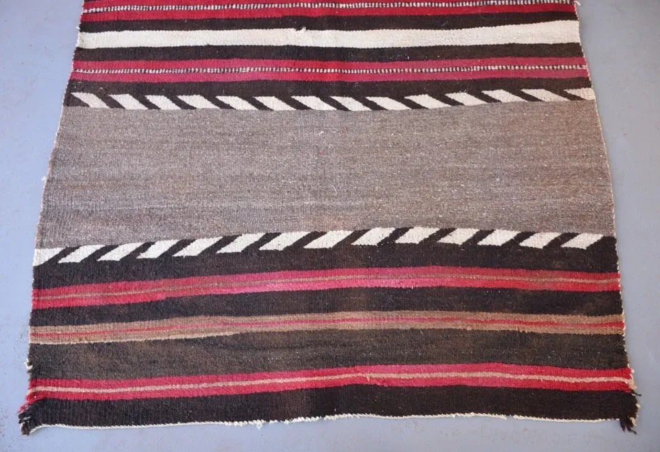 OLD NAVAJO TRANSITIONAL BANDED BLANKET 63" X 45": OLD NAVAJO TRANSITIONAL BANDED BLANKET 63" X 45" This old banded Navajo blanket has three wide bands with some deep reds and dark browns. This rug is in fair to poor condition because of the 2 large h
