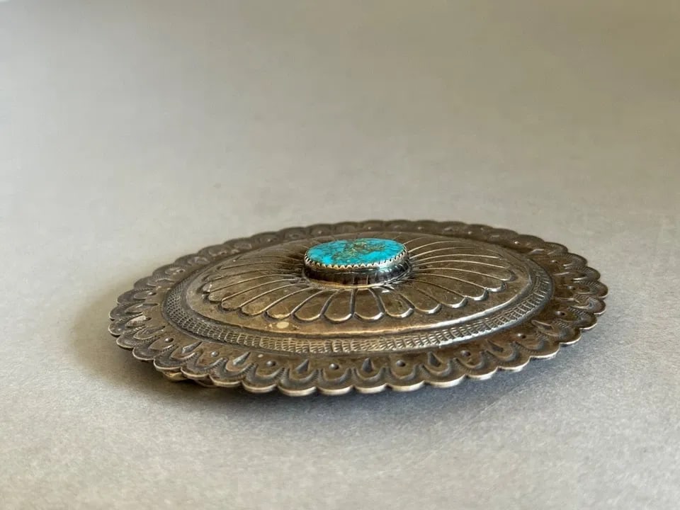 JENNIE BLACKGOAT ( 1932- 2005) NAVAJO STERLING SILVER W TURQUOISE BELT BUCKLE: JENNIE BLACKGOAT ( 1932- 2005) NAVAJO STERLING SILVER W TURQUOISE BELT BUCKLE Large Vintage Navajo Jennie Blackgoat Sterling Silver w Turquoise Belt Buckle ..3 3/4" x 3" ..65 Grams