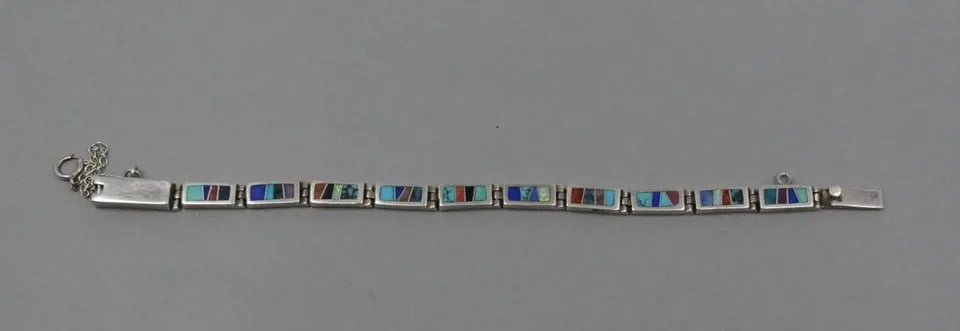 VINTAGE NAVAJO SILVER LINK BRACELET MULTICOLOR INLAY TOUCH OF SANTA FE - 7 5/8": VINTAGE NAVAJO SILVER LINK BRACELET MULTICOLOR INLAY TOUCH OF SANTA FE - 7 5/8" Sterling Silver Navajo Link Bracelet with inlay of Turquoise, Lapis, Coral and other semi-precious stones. Signed Touch 