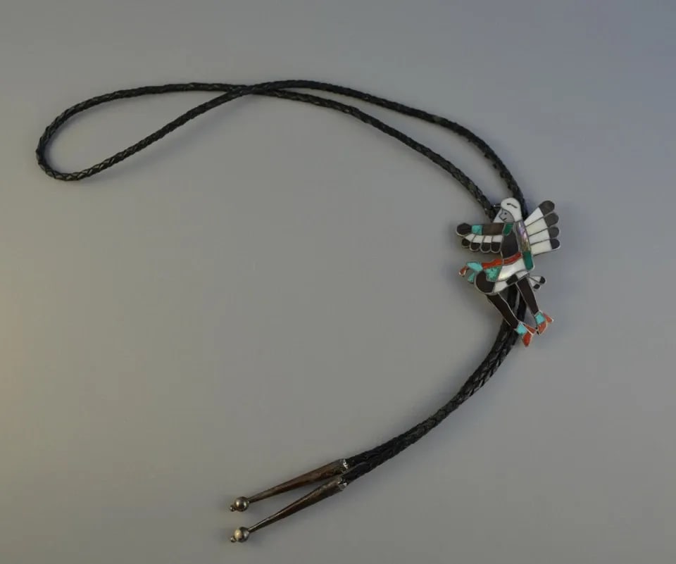 OLD PAWN ZUNI STERLING SILVER INLAY BOLO TIE - EAGLE DANCER - WILLIAM ZUNIE: OLD PAWN ZUNI STERLING SILVER INLAY BOLO TIE - EAGLE DANCER - WILLIAM ZUNIE Item Description: This vintage bolo tie has been beautifully crafted by Zuni artist William Zunie. It shows an Eagle dancer 