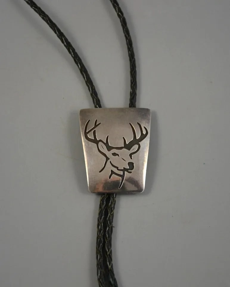MARVIN C. LOMAHEFTEWA - VINTAGE HOPI INDIAN STERLING SILVER BOLO TIE - DEER: MARVIN C. LOMAHEFTEWA - VINTAGE HOPI INDIAN STERLING SILVER BOLO TIE - DEER This vintage bolo tie has been beautifully designed and crafted by Hopi silversmith Marvin Lomaheftewa. The bolo measures 2"