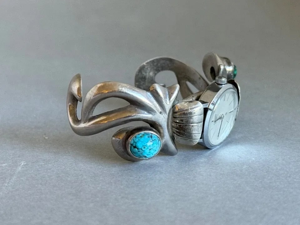 VINTAGE NAVAJO STERLING SILVER CAST WATCH BRACELET WITH TURQUOISE.: VINTAGE NAVAJO STERLING SILVER CAST WATCH BRACELET WITH TURQUOISE. Vintage Navajo Sterling Silver Cast Watch Bracelet with Turquoise. 1" Wide .. 4 1/2" Inside with a 1 3/8" Opening ..1.5oz ..