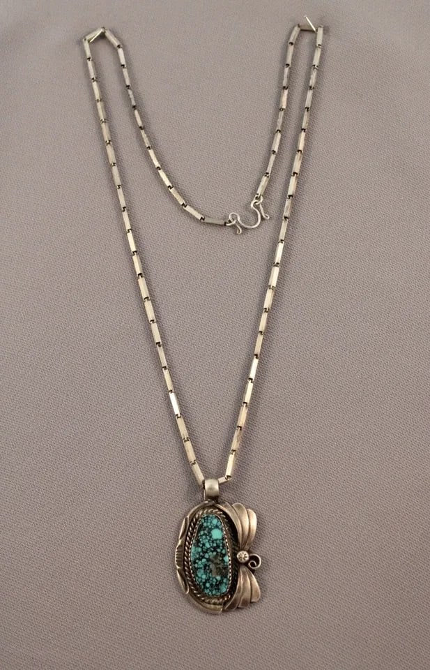 VINTAGE NAVAJO OR SANTO DOMINGO GREAT TURQUOISE PENDANT.. SIGNED ..: VINTAGE NAVAJO OR SANTO DOMINGO GREAT TURQUOISE PENDANT.. SIGNED .. Item Description: Pendant 1 1/2” Tall 1” width Great Turquoise Comes with Sterling Chain