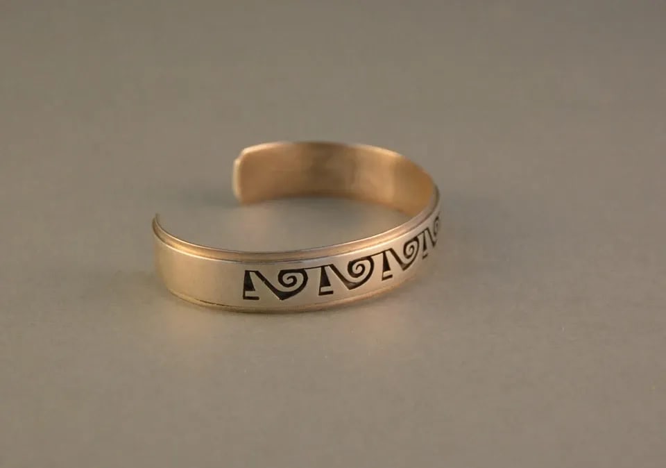 AUGUSTINE MOWA - HOPI INDIAN STERLNG SILVER ON SILVER BRACELET - 7 3/8": AUGUSTINE MOWA - HOPI INDIAN STERLNG SILVER ON SILVER BRACELET - 7 3/8" Item Description: This bracelet has been beautifully crafted by Hopi artist Augustine Mowa. It shows a wonderful design of whirl