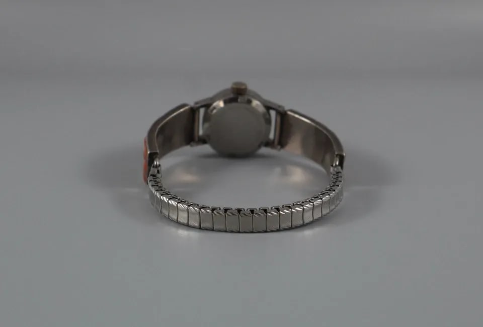 OLD PAWN ZUNI STERLING AND CORAL WATCHBAND WOMENS SWISS WATCH 17 JEWELS: OLD PAWN ZUNI STERLING AND CORAL WATCHBAND WOMENS SWISS WATCH 17 JEWELS Item Description: 1/2 " Wide X 1 1/8 " Long Coral Band ..Working self Wind Swiss Watch 17 Jewel Traditions ..