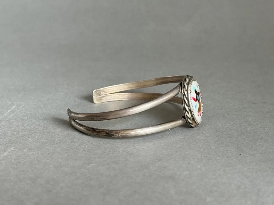 VINTAGE ZUNI STERLING SILVER WITH INLAID GHAN DANCER BRACELET: VINTAGE ZUNI STERLING SILVER WITH INLAID GHAN DANCER BRACELET Vintage Zuni Sterling Silver with Inlaid Multi Stone and Shell Ghan Dancer Bracelet ..3/4 " Tall 5 1/8" Inside with a 1 1/8 " Opening ..