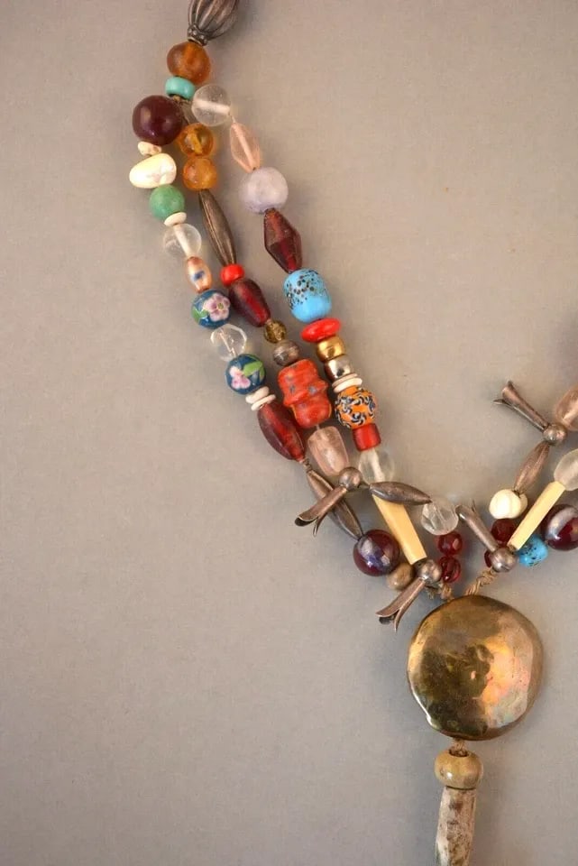 OLD TREASURE NECKLACE - 3 STRAND STONE GLASS ENAMEL SHELL SILVER BEADS & CROSS: OLD TREASURE NECKLACE - 3 STRAND STONE GLASS ENAMEL SHELL SILVER BEADS & CROSS Item Description: This vintage treasure necklace has been strung with Navajo silver beads, glass beads, stone beads, enam