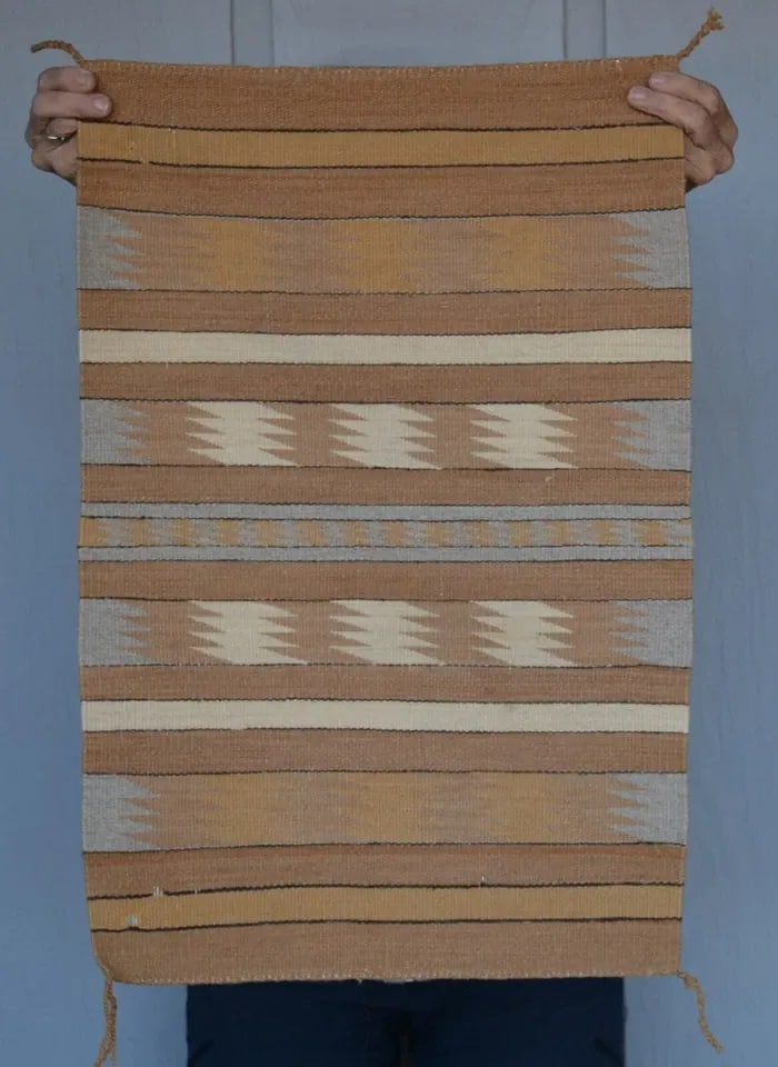 FINELY WOVEN CHINLE NAVAJO RUG - VINTAGE - TANS GRAYS WHITE - 26" X 17": FINELY WOVEN CHINLE NAVAJO RUG - VINTAGE - TANS GRAYS WHITE - 26" X 17" This finely woven Chinle Navajo rug is in good condition except for a couple of old small holes from moths near the bottom.