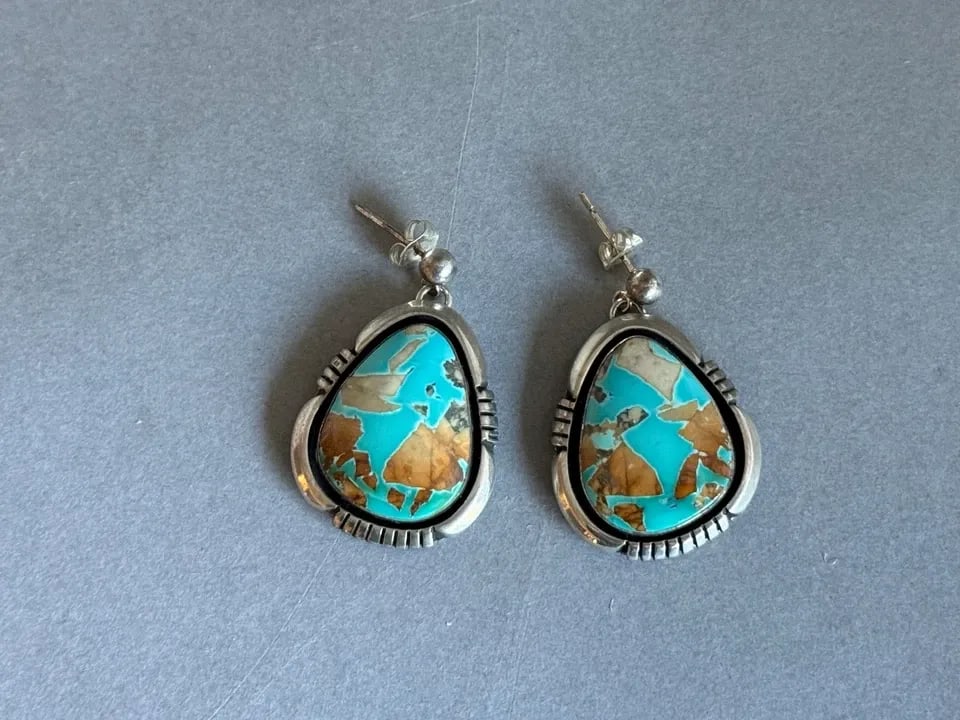 NAVAJO STERLING SILVER WITH NATURAL OJO TURQUOISE EARRINGS. 1 1/8" DROP: NAVAJO STERLING SILVER WITH NATURAL OJO TURQUOISE EARRINGS. 1 1/8" DROP Navajo Sterling Silver with Natural Turquoise Earrings. Turquoise is from Ojo Arizona, private mine. Signed D