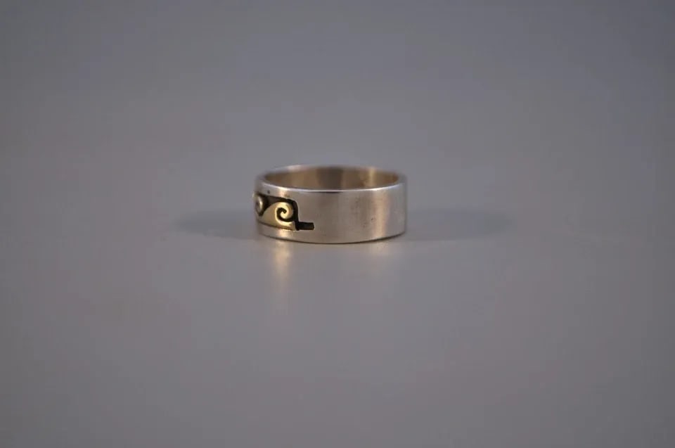 SOLID 14 KT. GOLD ON STERLING SILVER NAVAJO RING SCOTT SKEETS - 4 3/4: SOLID 14 KT. GOLD ON STERLING SILVER NAVAJO RING SCOTT SKEETS - 4 3/4 This is a new Navajo sterling silver ring with a solid 14 Karat wave design. It has been handcrafted by Navajo artist Scott Skeets