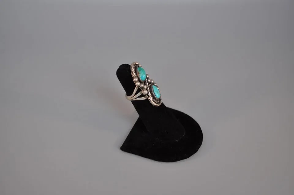 OLD PAWN NAVAJO SILVER RING - TURQUOISE SIZE 4 1/2: OLD PAWN NAVAJO SILVER RING - TURQUOISE SIZE 4 1/2 Weight 10.12 Grams 1 3/8" tall Old Pawn Jewelry dates from the early 1900s to the 1970s. Most of it is not signed because it wasn't the Native Americ