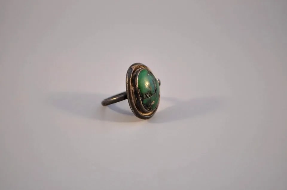 OLD PAWN NAVAJO STERLING SILVER RING - TURQUOISE SIZE 7: OLD PAWN NAVAJO STERLING SILVER RING - TURQUOISE SIZE 7 Weight 8.81 Grams 1" Tall Old Pawn Jewelry dates from the early 1900s to the 1970s. Most of it is not signed because it wasn't the Native Americ